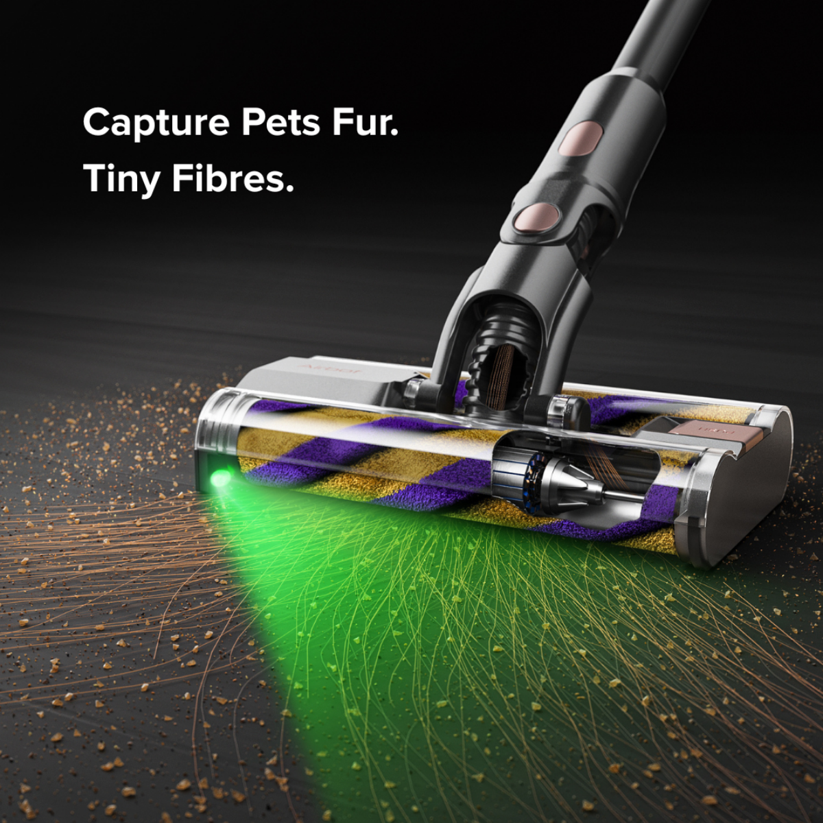 Vacuum cleaner head with green light on a dark background, highlighting pet hair and tiny fibres.